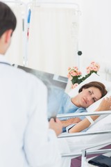 Doctor visiting patient in hospital