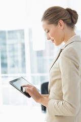 Beautiful businesswoman using digital tablet in office