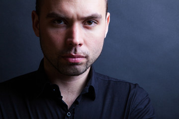 Young handsome man with serious expression