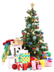 Decorated Christmas tree with gifts isolated on white