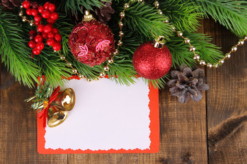 Fototapeta na wymiar Christmas card on wooden background