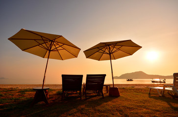 Relax Chair on Beach at Sunrise