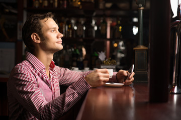 man with a cup of coffee