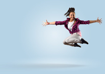 Fototapeta na wymiar young female dancer jumping