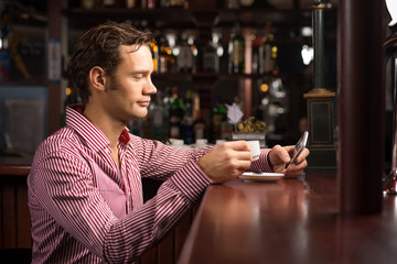 man with a cup of coffee