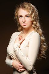 Naklejka premium Lovely model with shiny volume curly hair