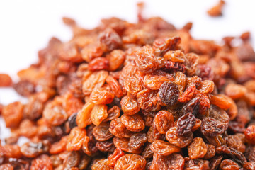 Raisins on white background