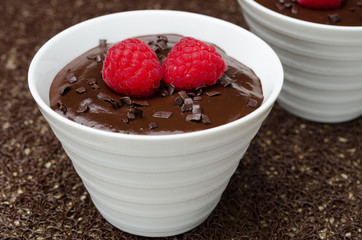 chocolate mousse with fresh raspberries, close-up