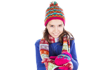 Beautiful little girl in cap and scarf