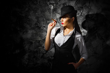 Dangerous and beautiful criminal girl with cigar