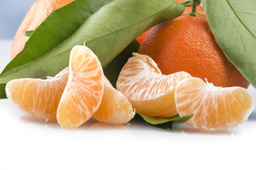 Orange mandarin or tangerine fruit with leaves