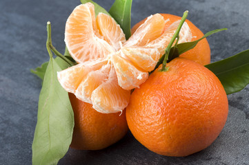 Orange mandarin or tangerine fruit with leaves