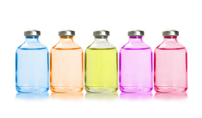 Obraz na płótnie Canvas Five colored bottles with essential oils