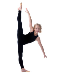Fototapeta premium Image of flexible little girl doing vertical split