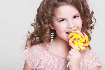 Happy child with candy lollipop Funny baby girl