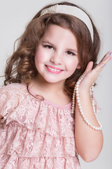 Portrait little girl in lace dress, funny trendy kid