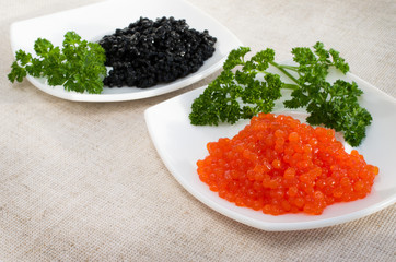 red and black caviar is in a serving plate