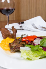 Grilled pork chop with lettuce and barbecue sauce