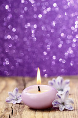 Fototapeta na wymiar Scented candle and hyacinth flowers.