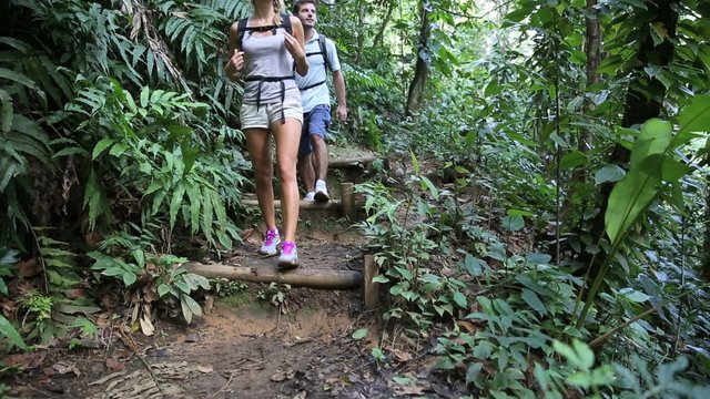 Couple on a trekking day in tropical forest