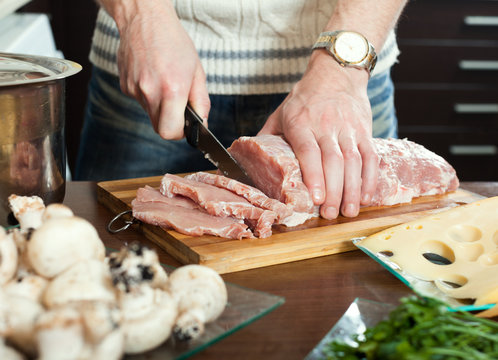 cutting raw meat