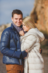 portrait of a young couple on a background of mountains