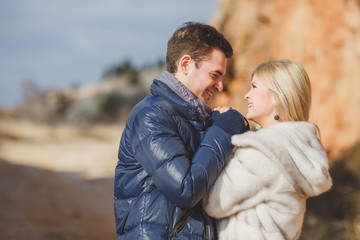 Fototapeta premium portrait of a young couple on a background of mountains