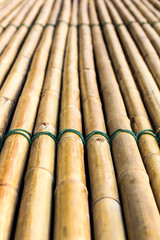 Background of bamboo raft with a rope tightly bonded