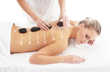 Obraz na płótnie Canvas A healthy woman getting alternative massage treatment