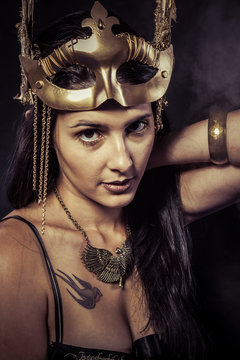 Valkyrie, Golden statue concept. Arty portrait of model with gol