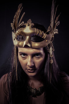 Valkyrie, Golden statue concept. Arty portrait of model with gol