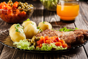 Breaded cutlet and potatoes