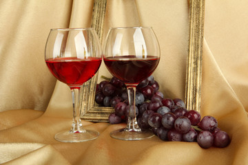 composition of frame,wine and grapes on bright background