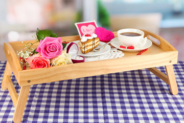Breakfast in bed on Valentine's Day on room background