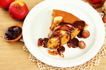 slice of tasty homemade pie with chocolate and apples,