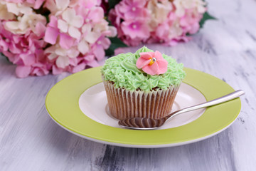 Tasty cupcake with butter cream,