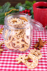 Delicious Christmas cookies in jar on table close-up