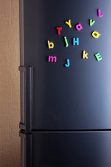 Colorful magnetic letters on  refrigerator