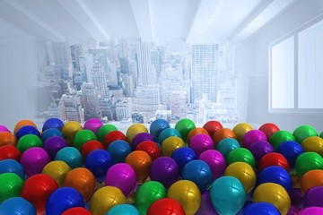 Many colourful balloons in room with city scene