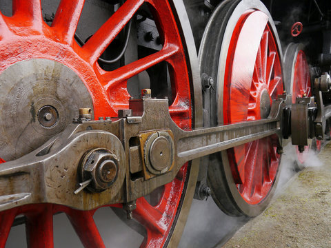 Red wheels of steam locomotive.