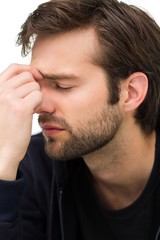 Obraz premium Close-up of a stressed handsome young man