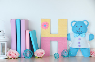 Shelf decorated with handmade knit letter