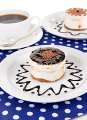 Sweet cakes with chocolate on plate on table close-up