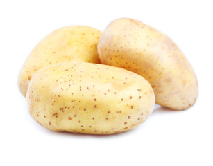 Ripe potatoes on white.