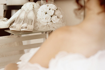 Wedding-Bride with wedding shoes & flowers