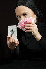 Woman in black playing cards