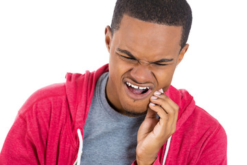 Young man having toothache