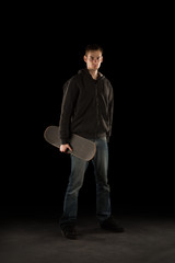 Young Adult Holding Skateboard