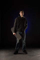 Young Adult Holding Skateboard