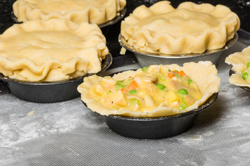 Turkey pot pies being prepared in a kitchen